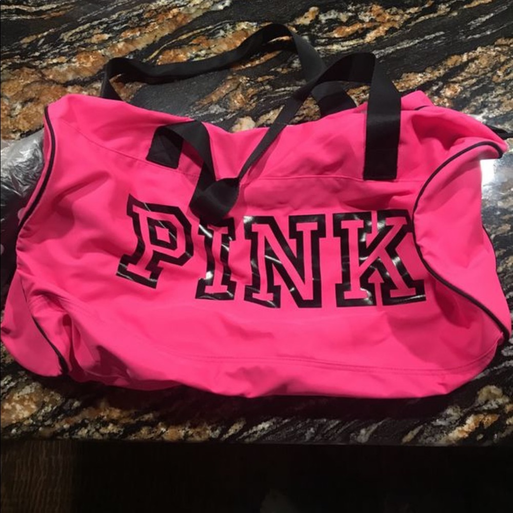 Athletic pink bag with water bottle